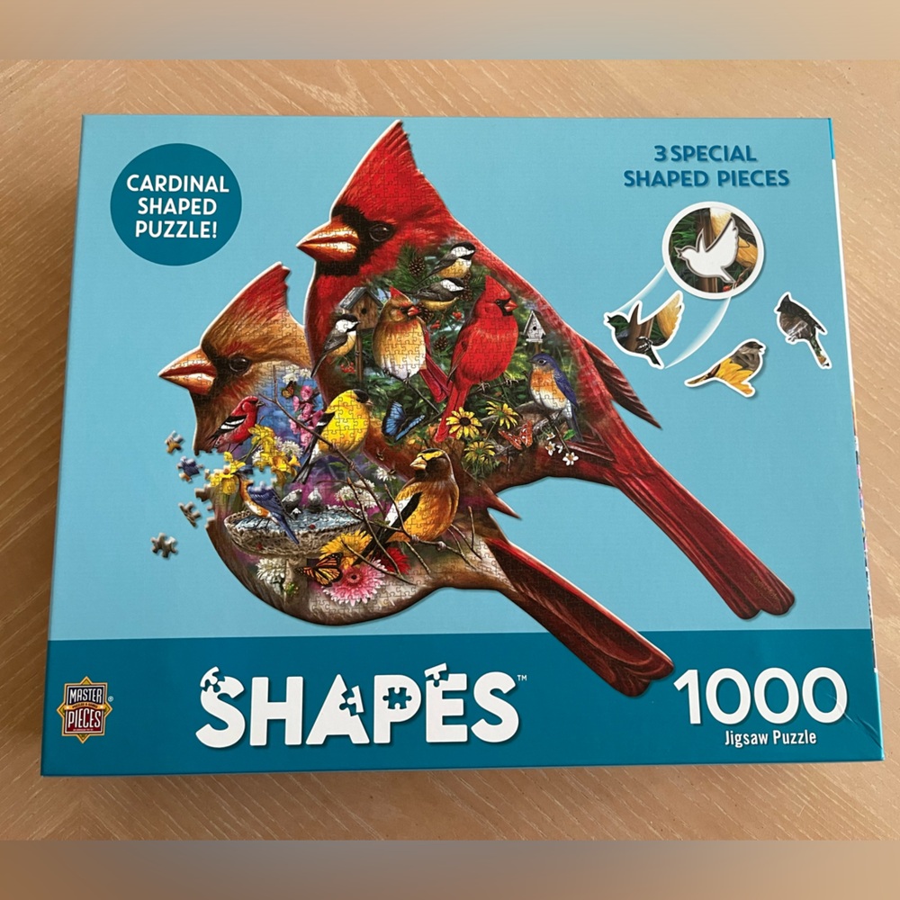 1000 piece jigsaw puzzle by Master Pieces. Cardinal shaped puzzle.